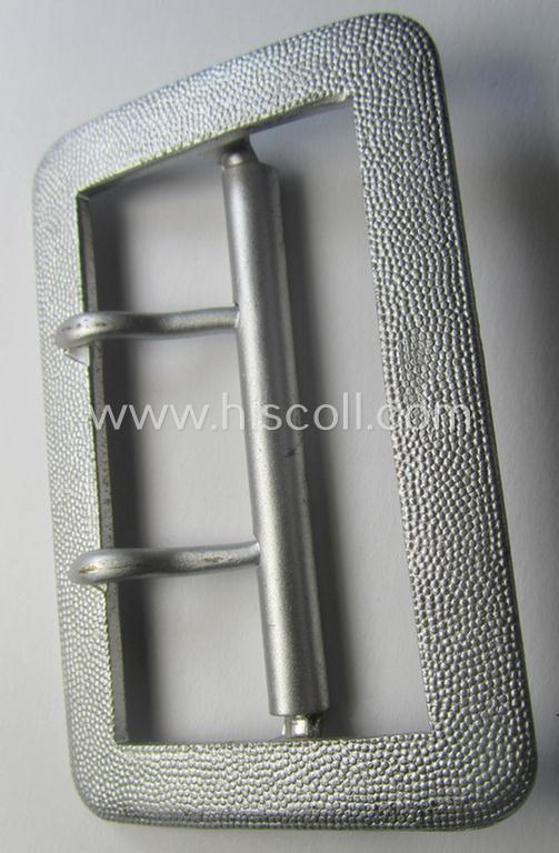 Interesting, WH (Heeres-, Luftwaffe ie. Waffen-SS etc.) bright-silver-coloured WH-officers'-type-belt-buckle (ie. 'Zweidornschnalle für Offiziere') being a simply never used- nor worn example that shows the makers'-designation: 'RzM 72'