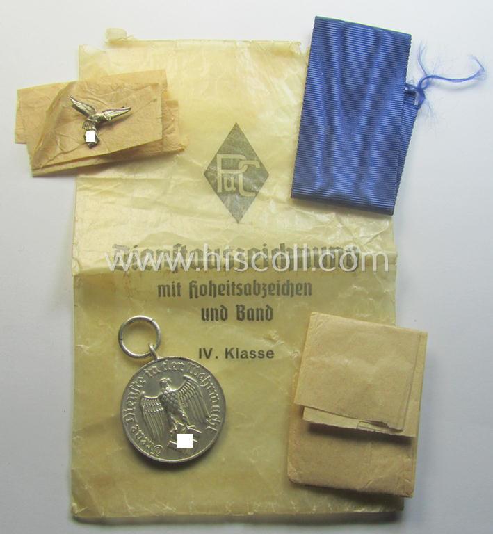 Superb - and usually seen! - WH (Luftwaffe) bright-silver-toned, 'WH-DA der 4. Klasse für 4 Jahre Dienstzeit' that comes with its accompanying ribbon (ie. 'Bandabschnitt') and eagle-device as stored in its period 'Cellophan'-based pouch