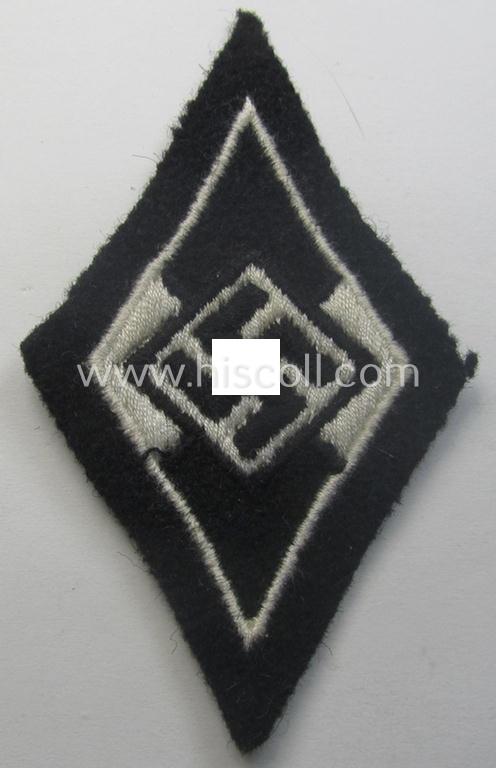 Waffen-SS-pattern, machine-embroidered and/or black- and white-coloured sleeve-insignia (ie. 'Ärmelraute') depicting a so-called: 'HJ-Raute' as was used and intended to signify former membership within the 'Hitlerjugend'