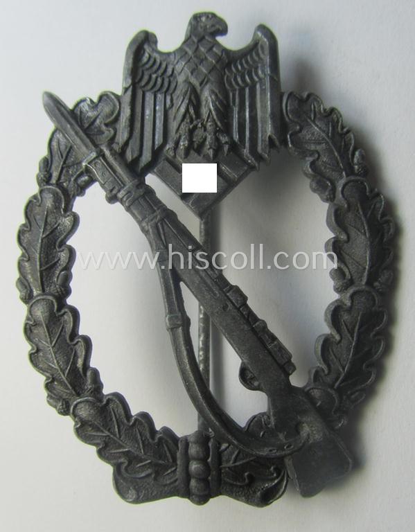 'Infanterie Sturmabzeichen in Silber' being a non-maker-marked and/or typical zinc- (ie. 'Feinzink'-) based version (ie. 'crimped scooped rifle-variant') as was (I deem) procuded by the: 'S&L'- (ie. 'Steinhauer u. Lück'-) company