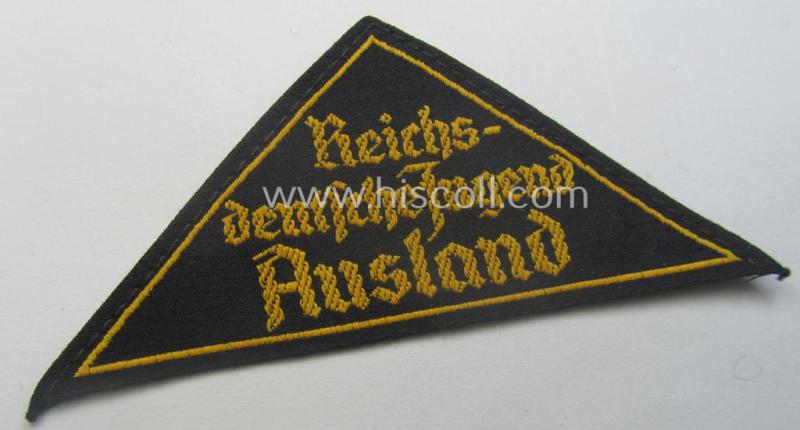 'HJ' ('Hitlerjugend') district-triangle (ie. 'Gebietsdreieck') entitled: 'Reichs-deutsche Jugend Ausland' being a 'virtually mint- ie. unissued' specimen that retains its 'RzM'-etiket