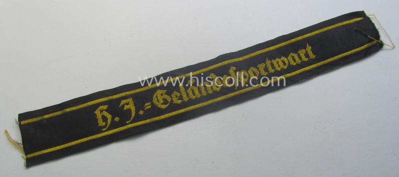 Truly worn- ie. tunic-removed, HJ (Hitlerjugend) cuff-title ie. 'tunic-stripe' (ie. 'Ärmelbänd') as was intended for a: 'HJ-Geländesportwart' (or: HJ-terrain-sports'-instructor)