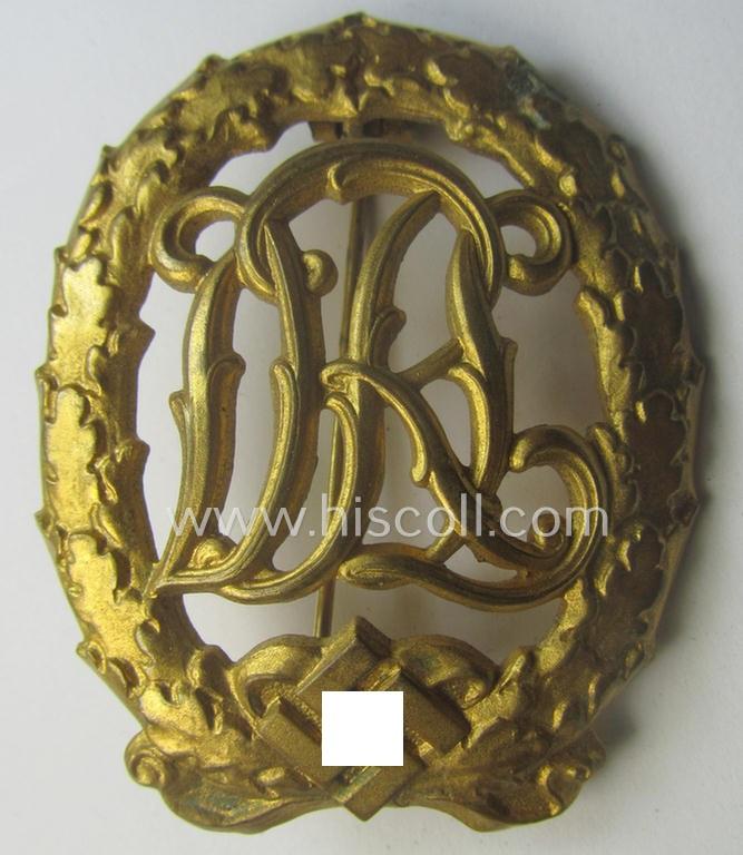 'Virtually mint' - and truly rarely found! - example of a: 'Reichssportabzeichen DRL in Gold' (or: DRL sports'-badge in gold) being a just moderately worn- ie. used example that is nicely maker- (ie. 'Wernstein - Jena'-) marked on its back