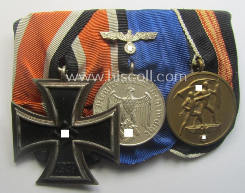 Three-pieced, WWII-period medal-bar (ie. 'Ordenspange') that resp. shows an: 'EK II. Kl.' (by the desirable 'Juncker'-company!), a: WH (Heeres o. KM) 'DA 4. St.' and a Czech 'Anschluss'-medal: '1. Oktober 1938'