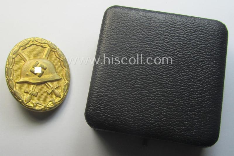 Rarely encountered 'Verwundeten-Abzeichen in Gold' being a clearly maker- (ie. 'L/11'- by 'Wilh. Deumer') marked- and typical 'Buntmetall'-based example that comes stored in its period- (and LDO-marked!) etui