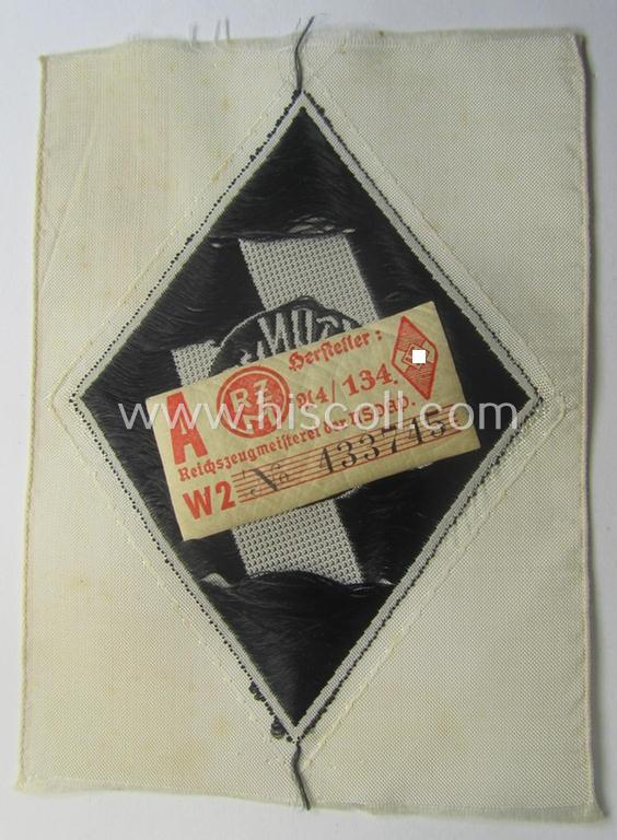 DJ- (ie. 'Deutsches Jungvolk'-) 'Leistungsabzeichen in Eisen in Stoff' that retains its period-attached 'RzM'-etiket