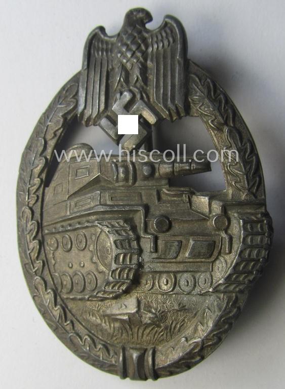 'Panzerkampfabzeichen in Silber' (or: silver-class panzer-assault badge or PAB) being a non-maker-marked- and/or hollow zinc- (ie. 'Feinzink'-) based example as was produced by the: 'Paul Meybauer'-company
