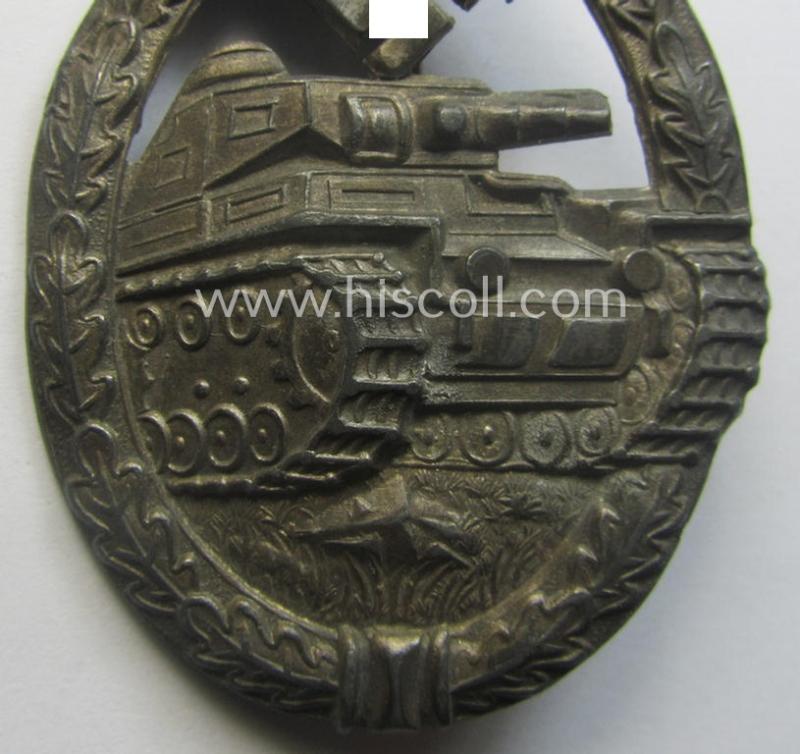'Panzerkampfabzeichen in Silber' (or: silver-class panzer-assault badge or PAB) being a non-maker-marked- and/or hollow zinc- (ie. 'Feinzink'-) based example as was produced by the: 'Paul Meybauer'-company