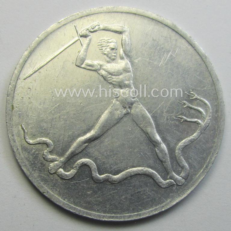Unusual, N.S.D.A.P.-related token (ie. 'Erinnerungs- o. nichttragbare Medaille') showing an illustration of a man fighting a 3-headed snake and bearing the text: 'Schlagt Lüge, Betrug und Verrat. Frei macht die Tat - Wählt Liste 10 - 24. April 1932'