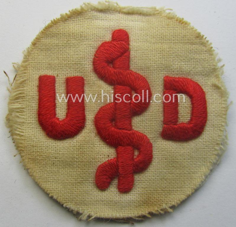 HJ/BDM (ie. 'Hitlerjugend'/'Bund Deutscher Mädel') trade- or specialist-armbadge ie. 'HJ-Ärmelabzeichen für Angehörige des Unfall-Dienstes' (being a detailed and hand-embroidered example)