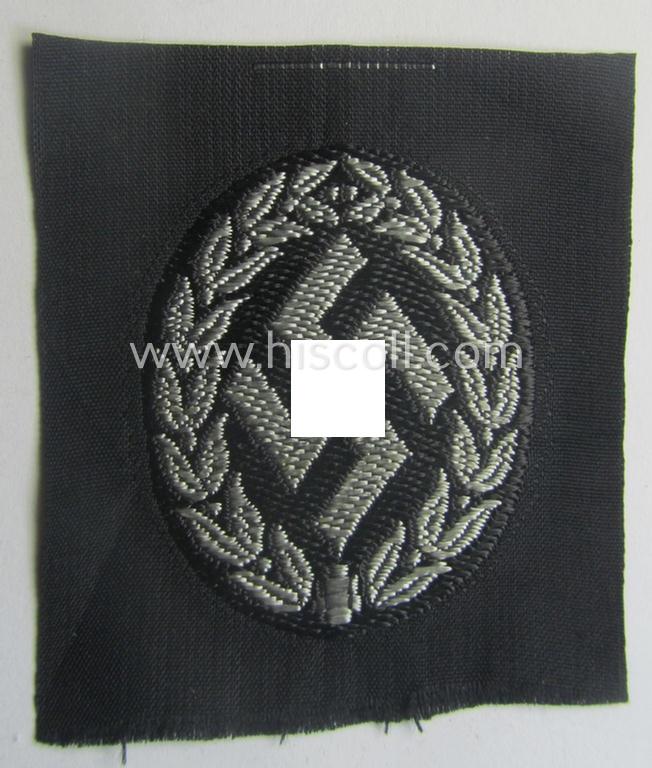 EM- (ie. NCO-) type, so-called: 'Schutzmannschaften' (or: 'Schuma') cap-badge as executed in greyish-coloured thread onto a black-coloured- (ie. 'SS-Polizei'- ie. 'SD'-related-) background
