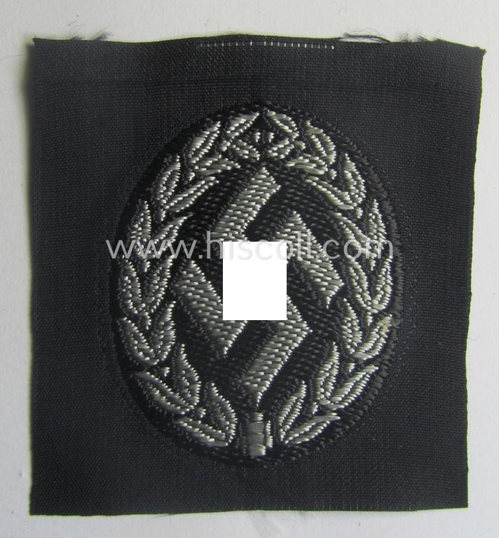 EM- (ie. NCO-) type, so-called: 'Schutzmannschaften' (or: 'Schuma') cap-badge as executed in greyish-coloured thread onto a black-coloured- (ie. 'SS-Polizei'- ie. 'SD'-related-) background