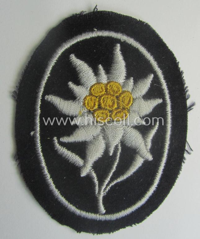 Waffen-SS-pattern, black-coloured sleeve-insignia (ie. 'Ärmelabzeichen') depicting an: 'Edelweiss'-flower as used by the various 'Gebirgsjäger'- (ie. mountain-troops-) related divisional-staff