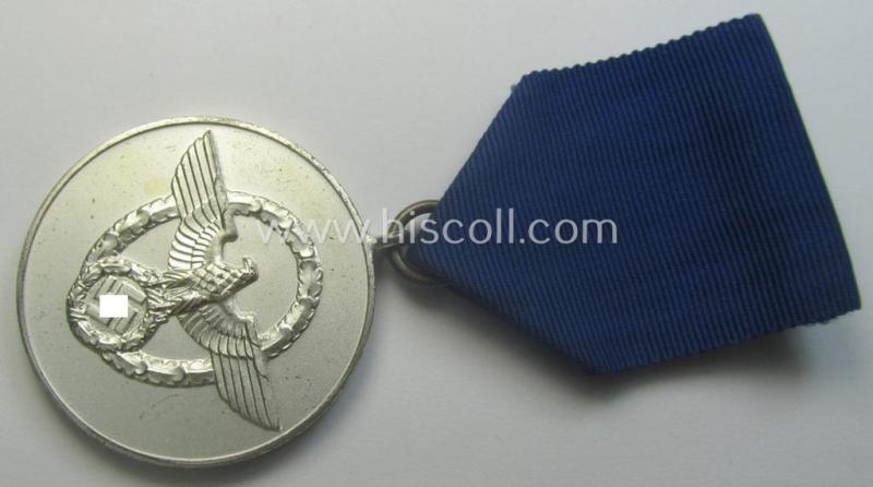 Bright-silver-toned so-called: 'Polizei-Dienstauszeichnung 3. Stufe' (or: police loyal-service medal 3rd class) that comes mounted onto its period ribbon (ie. 'Bandabschnitt')