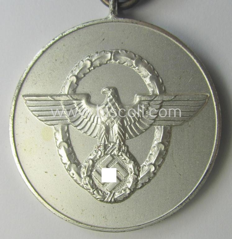 Bright-silver-toned so-called: 'Polizei-Dienstauszeichnung 3. Stufe' (or: police loyal-service medal 3rd class) that comes mounted onto its period ribbon (ie. 'Bandabschnitt')