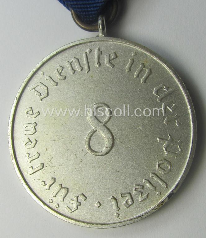 Bright-silver-toned so-called: 'Polizei-Dienstauszeichnung 3. Stufe' (or: police loyal-service medal 3rd class) that comes mounted onto its period ribbon (ie. 'Bandabschnitt')