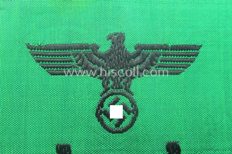 DRB- (ie. 'Deutsche Reichsbahn'-) related armband entitled: 'Reichsbahn' being of the 'entirely-woven'-type onto (typical) silk-like cloth in a technique similar to the 'BeVo'-weave pattern