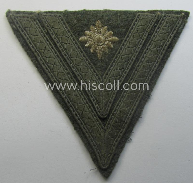WH (Heeres) 'Armwinkel' (or: arm-chevron) as executed on typical field-grey-coloured wool as was specifically intended for usage by a soldier with the (unusually encountered!) rank of: 'Stabsgefreiter'