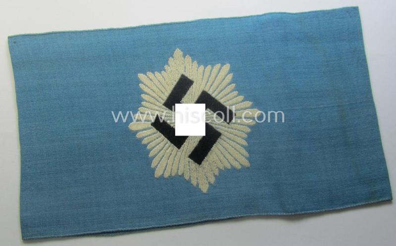Light-blue-coloured and neatly 'BeVo'-woven, so-called: RLB (or: 'Reichsluftschutzbund') 'Amtsträger'-armband depicting the typical 'RLB'-logo (without lettering) and showing an interwoven makers'-designation (ie. 'BeVo - Wuppertal')