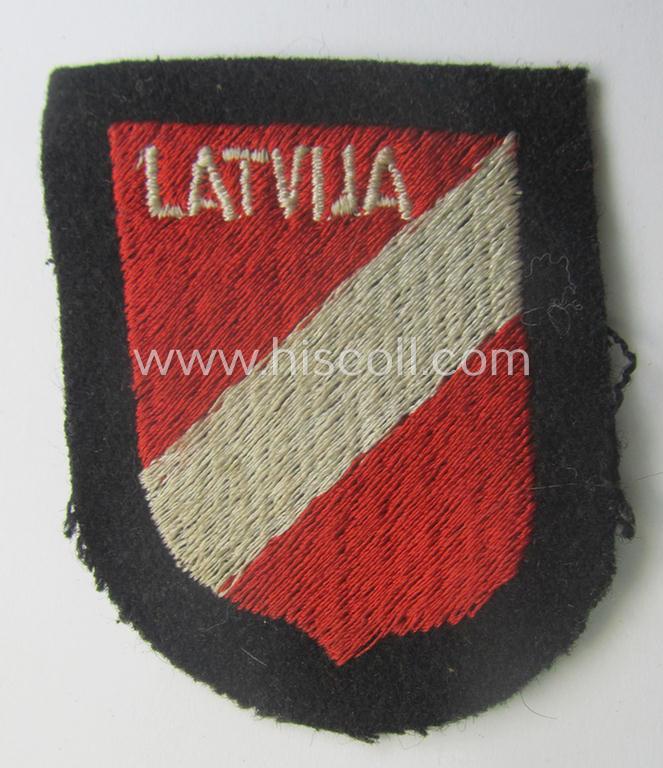 Waffen-SS 'volunteer'-arm-shield as was intended for usage by soldiers of the: '15. o. 19. Waffen-Grenadier-Division der SS' (ie. 'lettische nr. 1 o. 2') and that comes in a 'virtually mint- ie. unissued', condition