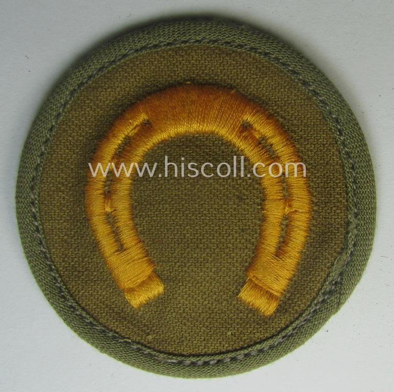 WH (Heeres) 'tropical'-issued, trade- and/or special-career insignia (ie. machine-embroidered 'Laufbahn- o. Tätigkeitsabzeichen') as was intended for an army: 'Hufbeschlagmeister' (or farrier)