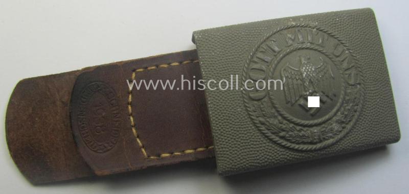 WH (Heeres) 'standard-pattern', field-grey-toned- and aluminium-based belt-buckle being a maker- (ie. 'E. Schneider - Lüdenscheid'-) marked- and/or: '1938'-dated example that comes mounted onto its leather-based tab