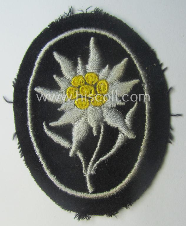 Waffen-SS-pattern, black-coloured sleeve-insignia (ie. 'Ärmelabzeichen') depicting an: 'Edelweiss'-flower as used by the various 'Gebirgsjäger'- (ie. mountain-troops-) related divisional-staff