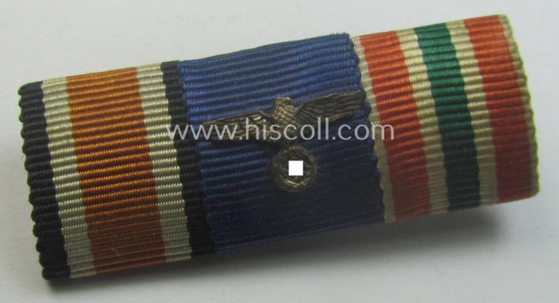 Neat, 3-pieced medal-bar (ie. 'Band- o. Feldspange') showing resp. the ribbons for an: 'EKII. Kl.', a: 'WH (Heeres) D.A. der 4. Stufe' and a: WH Memelland 'Anschluss'- (ie. occupation-) medal: '22 März 1939'