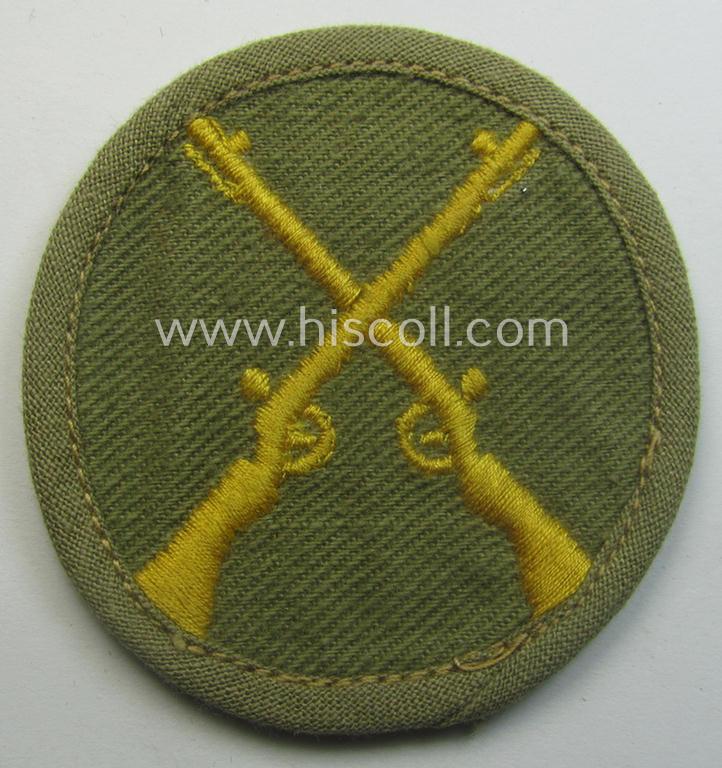 WH (Heeres) 'tropical'-issued, trade- and/or special-career insignia (ie. machine-embroidered 'Laufbahn- o. Tätigkeitsabzeichen') as was intended for an army: 'Waffenmeister' (or: weapon-equipment NCO)