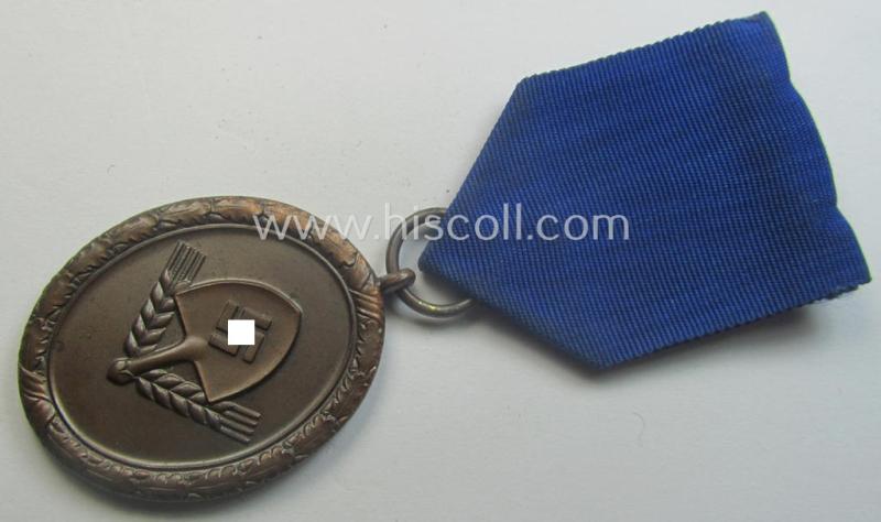 RAD (ie. 'Reichsarbeitsdienst'): 'Dienstauszeichnung 4. Stufe für Männer' as was intended for 4 years loyal-service and that comes mounted onto its period (broad-sized) ribbon (ie. 'Bandabschnitt')