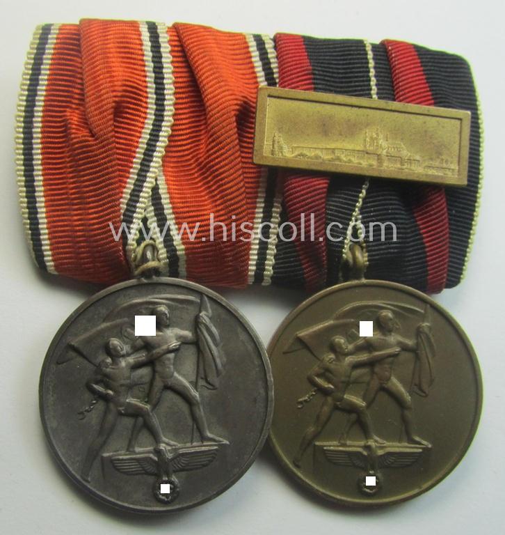 Two-pieced, WH (Heeres o. Kriegsmarine) medal-bar (ie.: 'Doppelspange') showing resp. an Austrian and Czech 'Anschluss'-medal (which latter comes with a firmly attached 'Prager Burg-Spange')