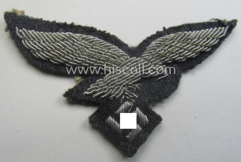 WH (Luftwaffe) officers'-pattern visor-cap-eagle (ie. 'Adler für LW-Offiziers-Schirmmütze') being a neatly hand-embroidered example of the: 'Extra Qualität' that comes in a moderately used- (ie. carefully cap-removed-), condition