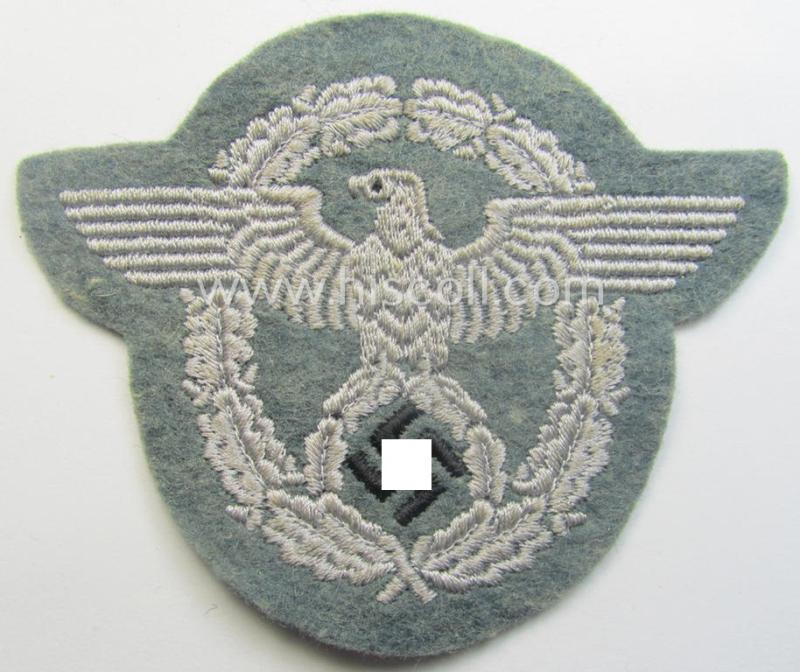 Police- (ie. 'Polizei'-) related armbadge (ie. arm-eagle) being a typical machine-embroidered example