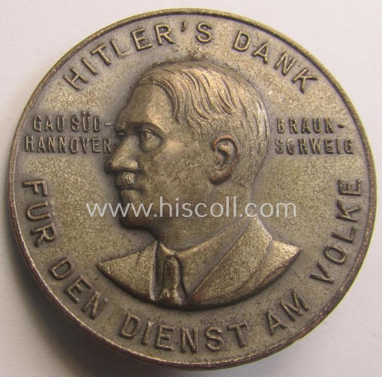 Commemorative, silvered 'Buntmetall'-based N.S.D.A.P.- (ie. WHW-) related 'tinnie' being a maker- (ie. 'Paulmann u. Crone'-) marked example depicting A.Hitler and text: 'Hitlers' Dank für den Dienst am Volke - Gau Süd-Hannover - Braunschweig'