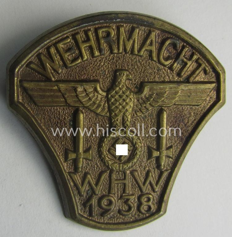 Golden-bronze-toned, W.H.W.- (ie. 'Winterhilfswerke'-) related day-badge (ie. 'tinnie') being a non-maker-marked example as was issued to commemorate the: 'WHW'-gathering ie. rally entitled: 'Wehrmacht - WHW - 1938'