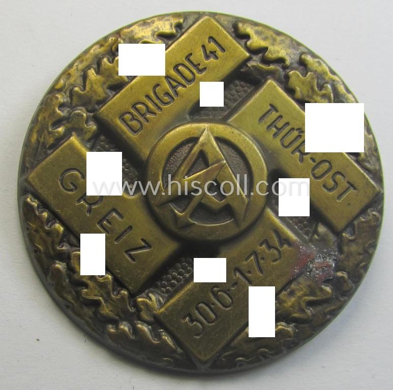 Golden-bronze-toned SA- (ie. 'Sturmabteilungen'-) related 'tinnie' being a non-maker-marked example depicting a swastika, SA-logo and text that simply reads: 'Brigade 41' - Thür-Ost - Greiz - 30.6-1.7-1934'