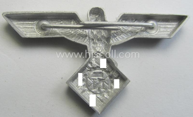Scarcely found, OT (ie.: 'Organisation Todt') silver-toned (ie. aluminium-based), EM- (ie. NCO- or officers') type visor-cap-eagle being a non-maker-marked example that comes in a simply never cap-attached- ie. still 'virtually mint', condition