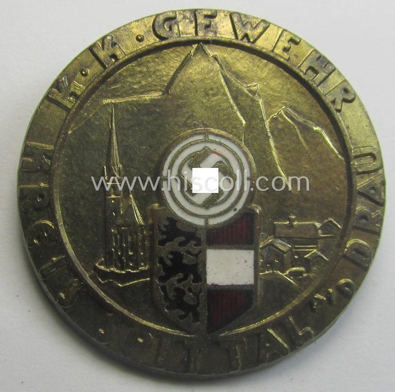 Unsual, golden-toned- and partly enamelled: 'Veranstaltungsabzeichen des Standschützenverbandes Tirol-Vorarlberg' depicting the text: 'K.K. Gewehr - Kreis Spittal a.d. Drau'