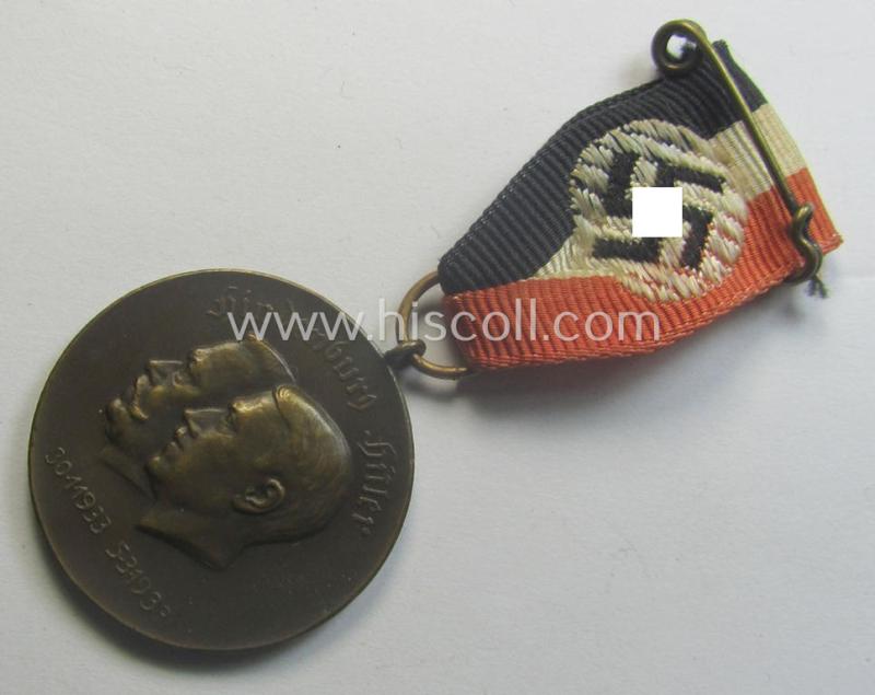 Darker-bronze-toned commemorative-medal (ie. 'Erinnerungs-Medaille') entitled: 'Hindenburg - Hitler - 30.1.1933 - 5.3.1933' and that comes mounted onto its period ribbon showing an interwoven swastika-device