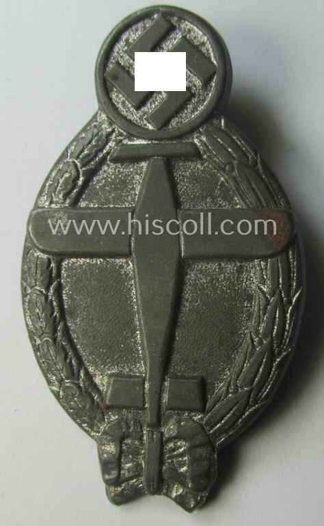 Commemorative, 'hollow-back'- and/or greyish-silver-toned, so-called: 'Flieger'-related day-badge (ie. 'tinnie') being a non-maker-marked example showing an illustration of a swastika and plane