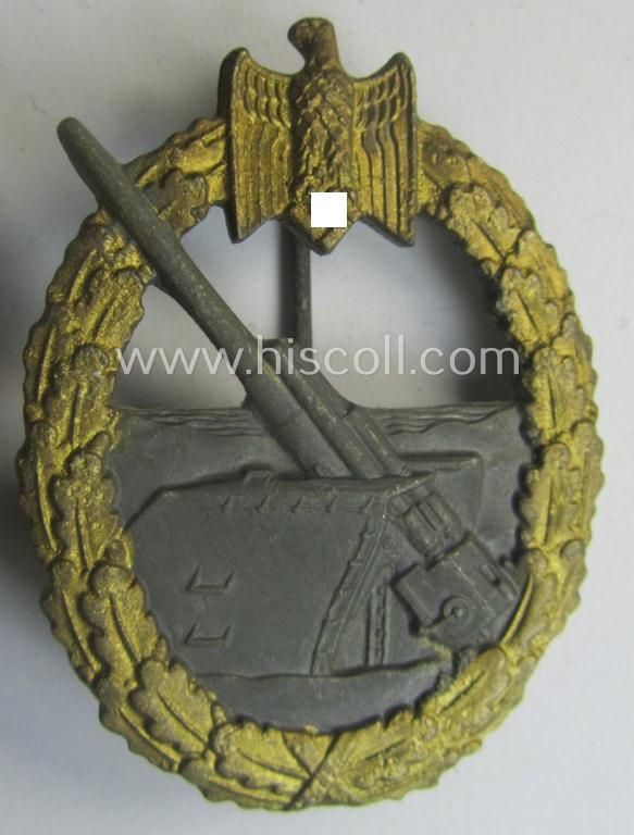 WH (Kriegsmarine) 'Marine-Artillerie-Abzeichen' being a typical non-maker-marked- and/or zinc- (ie. 'Feinzink'-) based example as was (presumably) produced by the: 'Alois Rettenmaier'-company