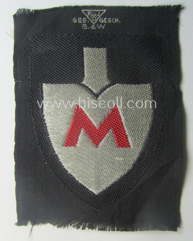Officers'-pattern, so-called: RAD (ie. 'Reichsarbeitsdienst') sleeve-badge (or: 'Dienststellenabzeichen') bearing the specialist-designation: 'M' (or: 'Hauptmeldebeambter')