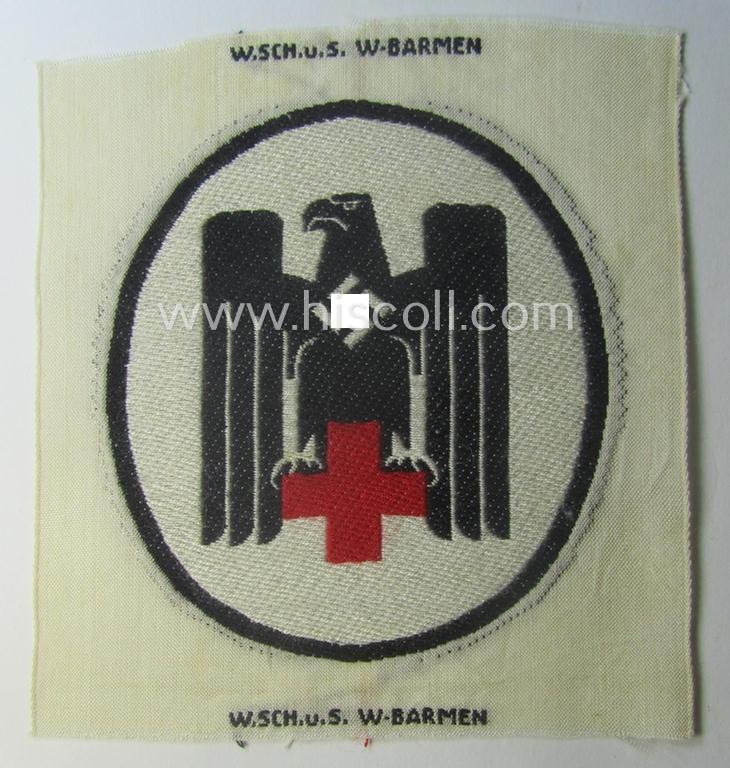 Neat - and actually scarcely encountered! - somewhat larger-sized DRK- (ie. 'Deutsches Rotes Kreuz'-) related sport-shirt emblem as was executed in the neat 'BeVo'-weave-pattern and that comes in a 'virtually mint' condition