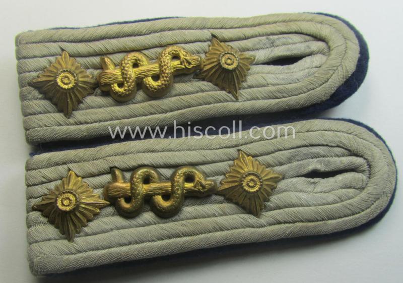 Pair of 'cyphered', WH (Heeres) officers'-pattern shoulderboards as piped in the darker-blue-toned branchcolour as was specifically intended for a: 'Hauptmann u. Arzt einer Sanitäts-Abtlgs.'