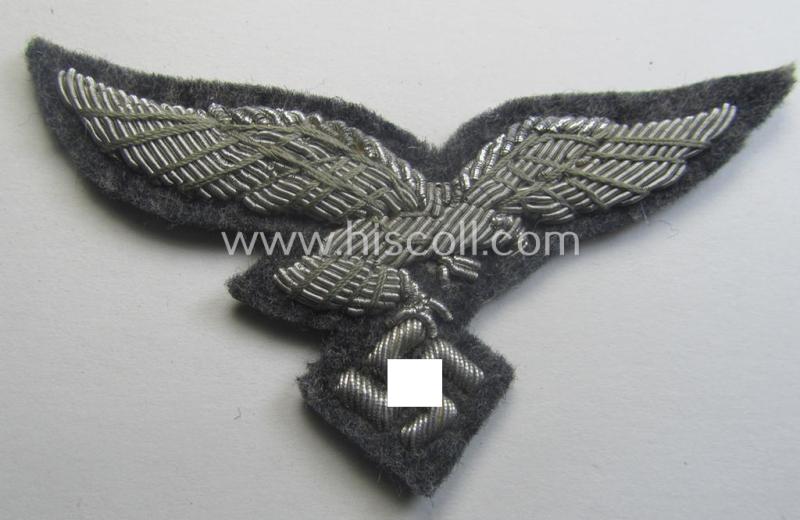 WH (Luftwaffe) officers'-pattern visor-cap-eagle (ie. 'Adler für LW-Offiziers-Schirmmütze') being a neatly hand-embroidered example of the: 'Extra Qualität' that comes in a simply never used- (ie. 'still virtually mint- ie. unissued'-), condition