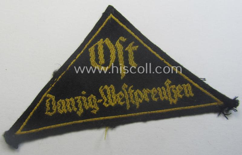 Extremely rarely encountered, 'HJ' ('Hitlerjugend') district-triangle (ie. 'Gebietsdreieck') entitled: 'Ost Danzig-Westpreussen' being a truly worn- ie. used specimen that misses its 'RzM'-etiket