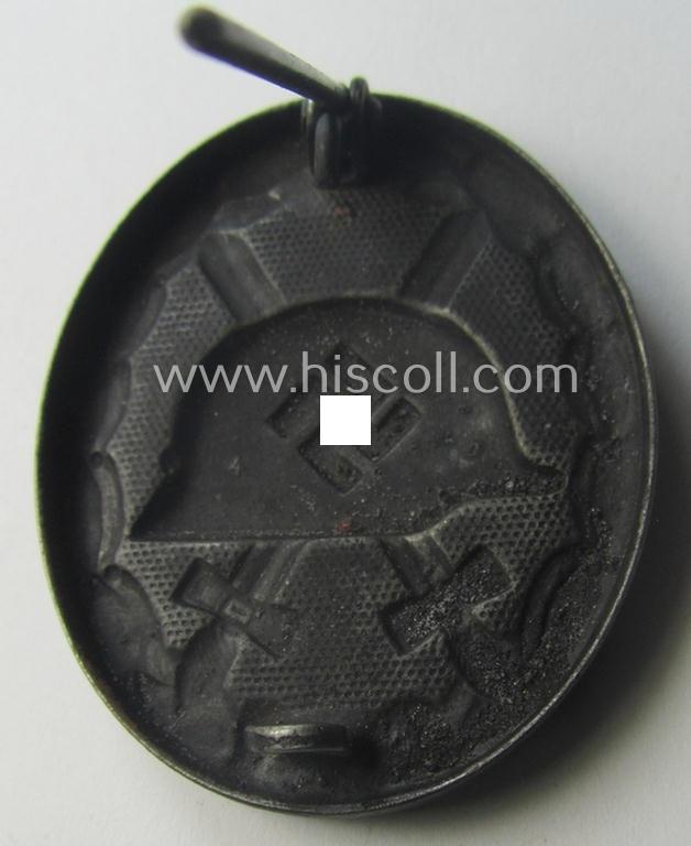 Black-class wound-badge (or: 'Verwundeten-Abzeichen in Schwarz') being a maker- (ie. '4'-) marked specimen as was produced by the maker (ie. 'Hersteller') named: 'Steinhauer & Lück'