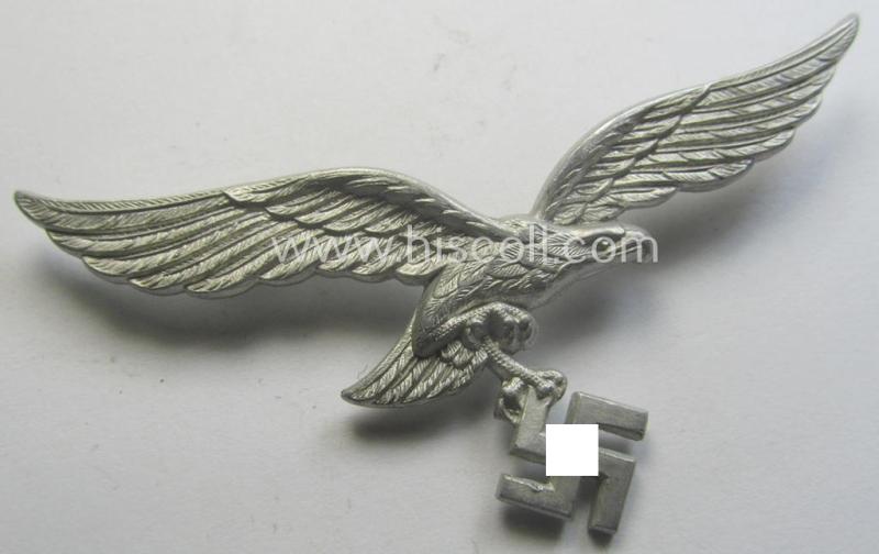 Minimally worn, WH (Luftwaffe) EM/NCO-pattern visor- (ie. 'Schirmmützen'-) cap-eagle being clearly maker- (ie. 'F.Sch.L.'-) marked example as executed in aluminium-based metal