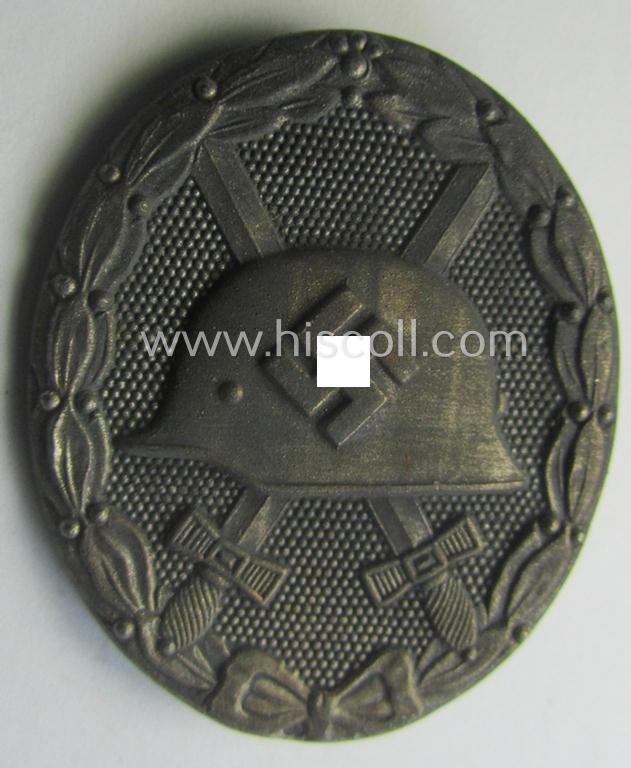 Moderately used- and/or worn 'Verwundeten-Abzeichen in Silber' being a typical maker- (ie. '65'-) marked- and/or: 'Feinzink'-based example by the maker: 'Klein & Quenzer'