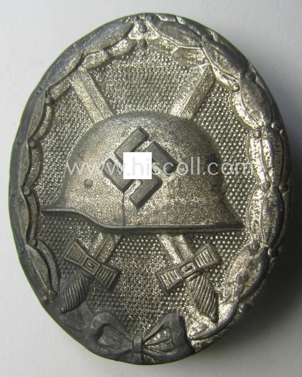 'Verwundeten-Abzeichen in Silber' being a clearly maker- (ie. '26'-) marked- and typical zinc- (ie. 'Feinzink'-) based example as was produced by the desirable maker: 'B.H. Mayer's Kunstprägeanstalt'